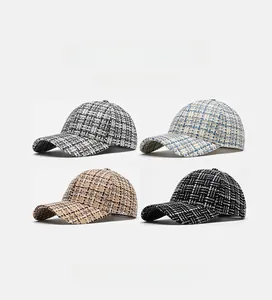 Detail showing four tweed baseball caps in black, blue, coffee, and solid black weave