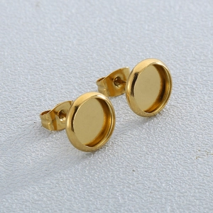 Minimalist 18K gold plated stainless steel disc stud earrings on a white surface