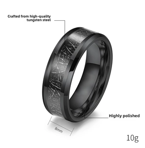 Detail of 8mm black tungsten steel ring with textured inlay and polished finish