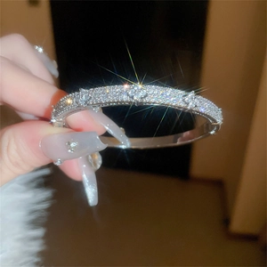 Elegant silver zircon flower bangle featuring a sparkling clover design for women