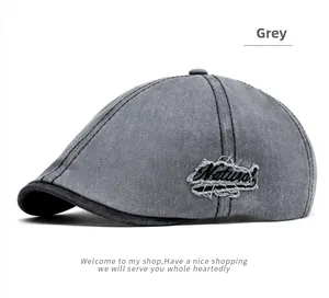 Detail of grey washed cotton ivy cap with embroidered Natural patch and frayed edges