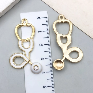 Golden stethoscope charms with white enamel and rhinestone for DIY jewelry making