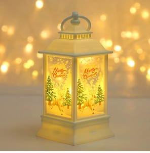 Detail of white Christmas lantern featuring reindeer illustrations and Merry Christmas text