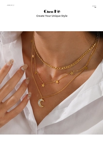 Detail of layered gold stainless steel necklace featuring Cuban chain, stars and moon pendant