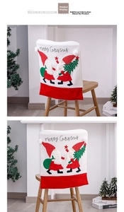 Close-up of Christmas chair covers with embroidered gnomes and Merry Christmas text