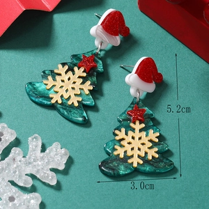 Christmas tree acrylic earrings with festive red hat and gold snowflake motifs