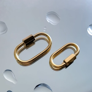 Macro shot of gold-plated stainless steel screw clasp connectors for jewelry making