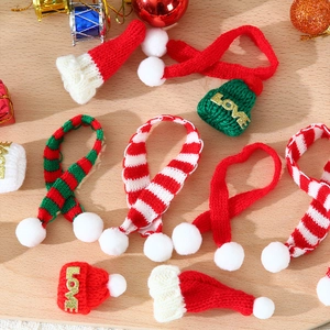 Miniature Christmas knit hats and scarves set featuring festive red and green winter patterns