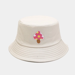 Cream bucket hat with pink mushroom embroidery made of premium twill cotton fabric