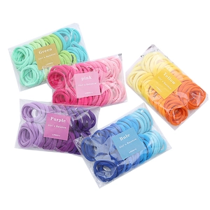 Detailed display of colorful nylon elastic hair ties set in clear packaging bags