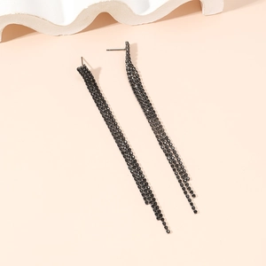 Detail of elegant black rhinestone long tassel earrings with a dark metallic finish