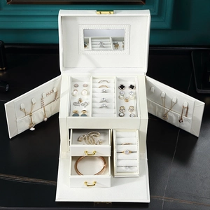 Front view of white multi-layer leather jewelry box with mirrors and open drawers