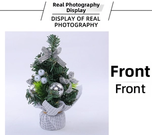 Close-up of mini Christmas tree with silver bows and ornaments on a checkered base