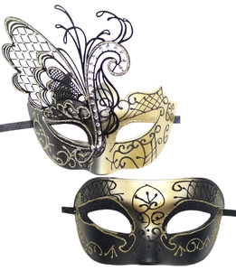 Detail of luxury metal butterfly masquerade masks with black gold accents and rhinestones