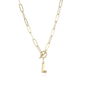 Detail of gold letter L pendant on paperclip chain with a stylish toggle clasp