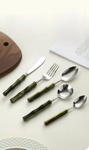 Macro shot of 1.40mm thick silver spoon with dark green bamboo style handle detail