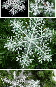Macro shot of white snowflake ornaments with shimmering fibers for Christmas tree decor