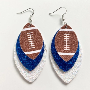 Detail view of triple-layered football earrings with brown leather and blue glitter teardrops
