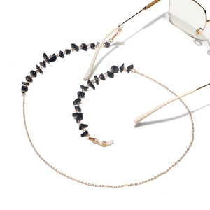 Handmade eyeglass chain featuring natural black stone beads and gold-tone links.