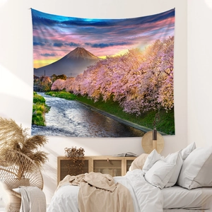 Detailed texture of bohemian Mount Fuji tapestry with cherry blossoms in a bedroom setup