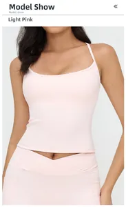 Close-up of the light pink sports bra showing racerback design and elastic fabric texture