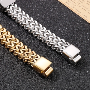 Detail of gold and silver braided titanium steel bracelets on vintage background