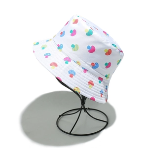 White bucket hat with colorful mushroom print shown on a black wire display stand