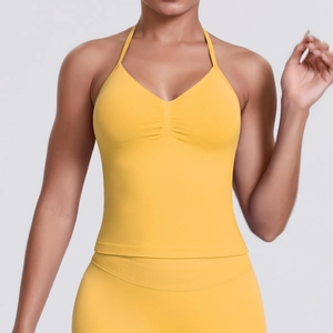 Close-up of seamless halter yoga top in bright yellow with ribbed texture and V-neckline