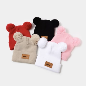 Winter knit hats set for kids in five colors featuring dual pompoms and mini leather tags