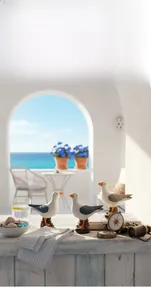 Mediterranean resin seagull ornaments featuring detailed distressed texture on a terrace