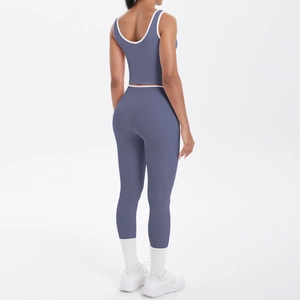 Detail view of the crisscross back design on a dusty blue and white yoga set