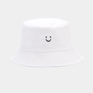 White double-sided bucket hat with smiley face embroidery for outdoor sun protection