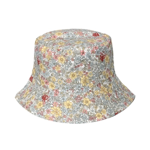 Close-up of lightweight cotton sun hat with colorful floral print and fine stitching