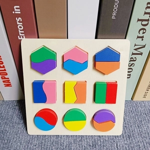 Close-up of wooden geometric puzzles in hexagon square and circle shapes for early learning