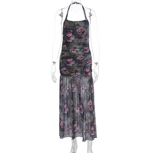 Close-up of ruched halter neckline and rose floral print on a sheer mesh dress