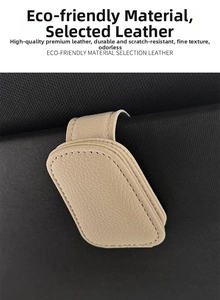 Macro detail of beige lychee texture leather car visor clip with precise stitching