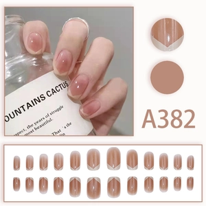 Short oval french press-on nails set in soft pink marble design with V-shape tips