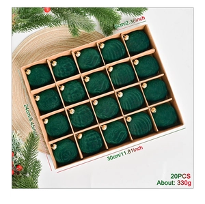 Close-up of 20-piece dark green velvet Christmas balls in a partitioned kraft box