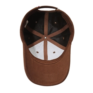 Interior view of a dark brown cotton baseball cap showing lining and stitching details
