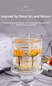 Detail of aromatic glass candle featuring yellow preserved roses and gold leaf flakes