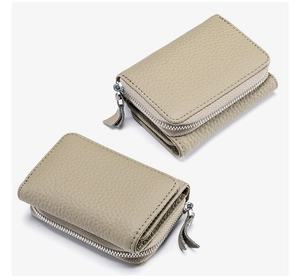 Detail of beige genuine leather trifold wallet with RFID blocking and lychee grain texture