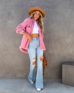 Detail view of pink frayed hem shacket and distressed denim jacket for women fashion