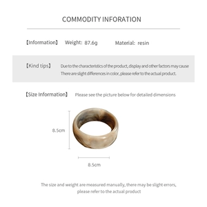 Information card showing an 8.5cm marbled resin bangle weighing 87.6g with dimensions detail