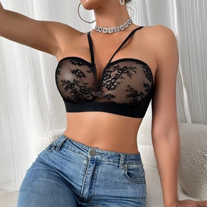 Close-up of black lace sheer tube bra with floral embroidery and V-cross detail