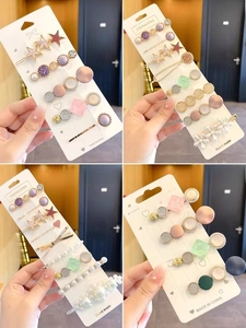 Detailed set of elegant pearl hair clips with rhinestones and floral resin accents