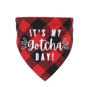 Detail of red and black plaid pet bandana with white IT'S MY Gotcha DAY text print