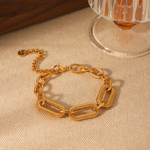 18K gold-plated stainless steel chunky oval chain bracelet with textured links on fabric