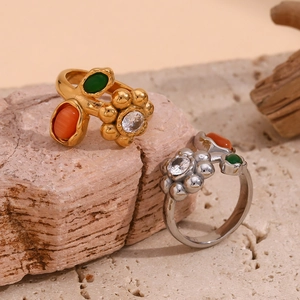 Vintage flower ring set in 18K gold and silver plating with colorful gemstones on rock