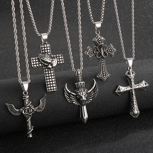 Gothic stainless steel pendants featuring winged lion, cobra, and cross motifs in silver