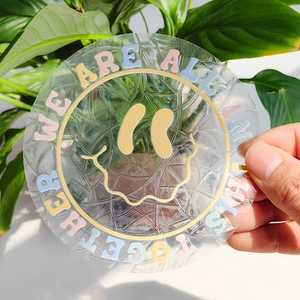 Detailed close-up of rainbow prism window sticker with suncatcher smile face design